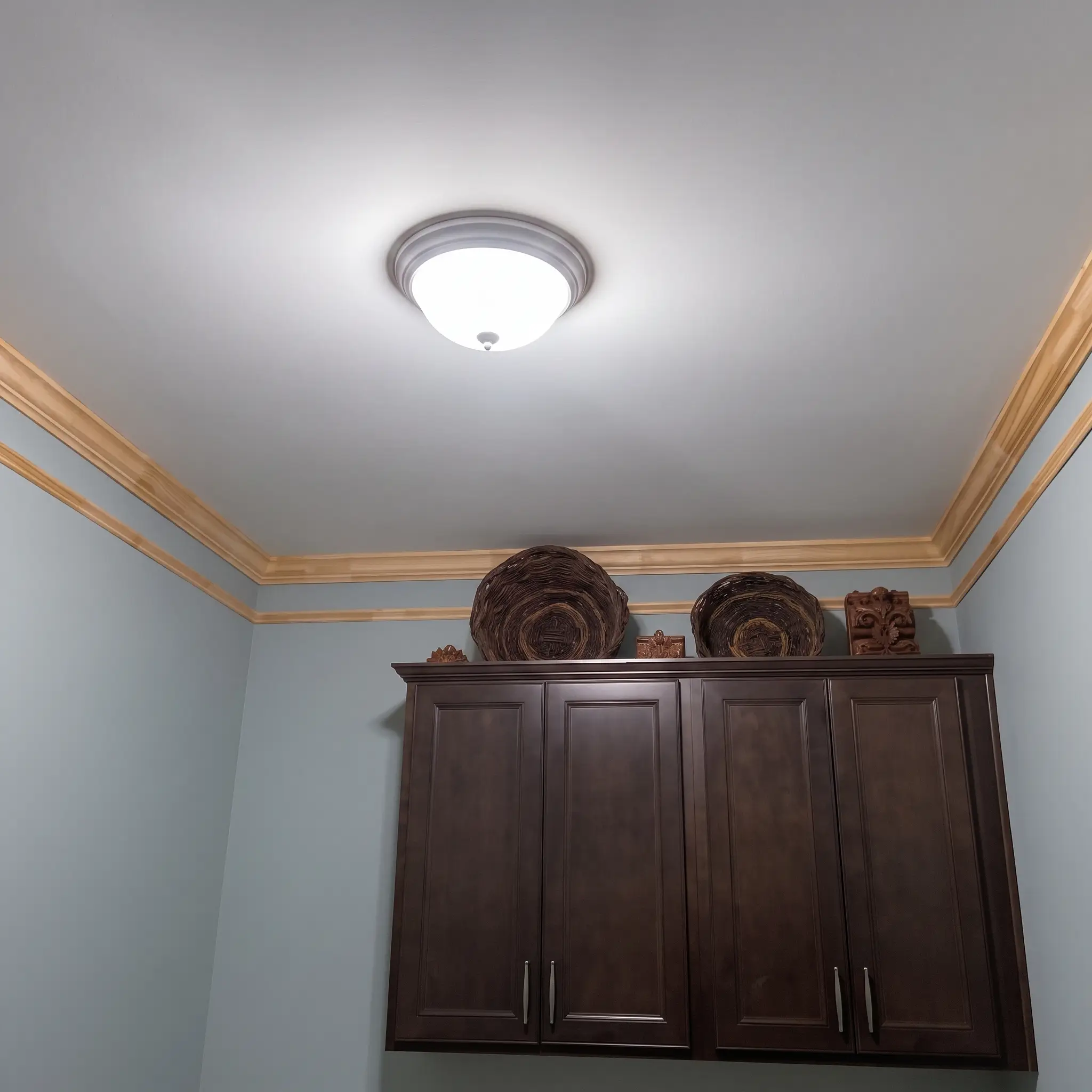 Custom wood crown molding and chair-rail trim installed by JND Home Solutions