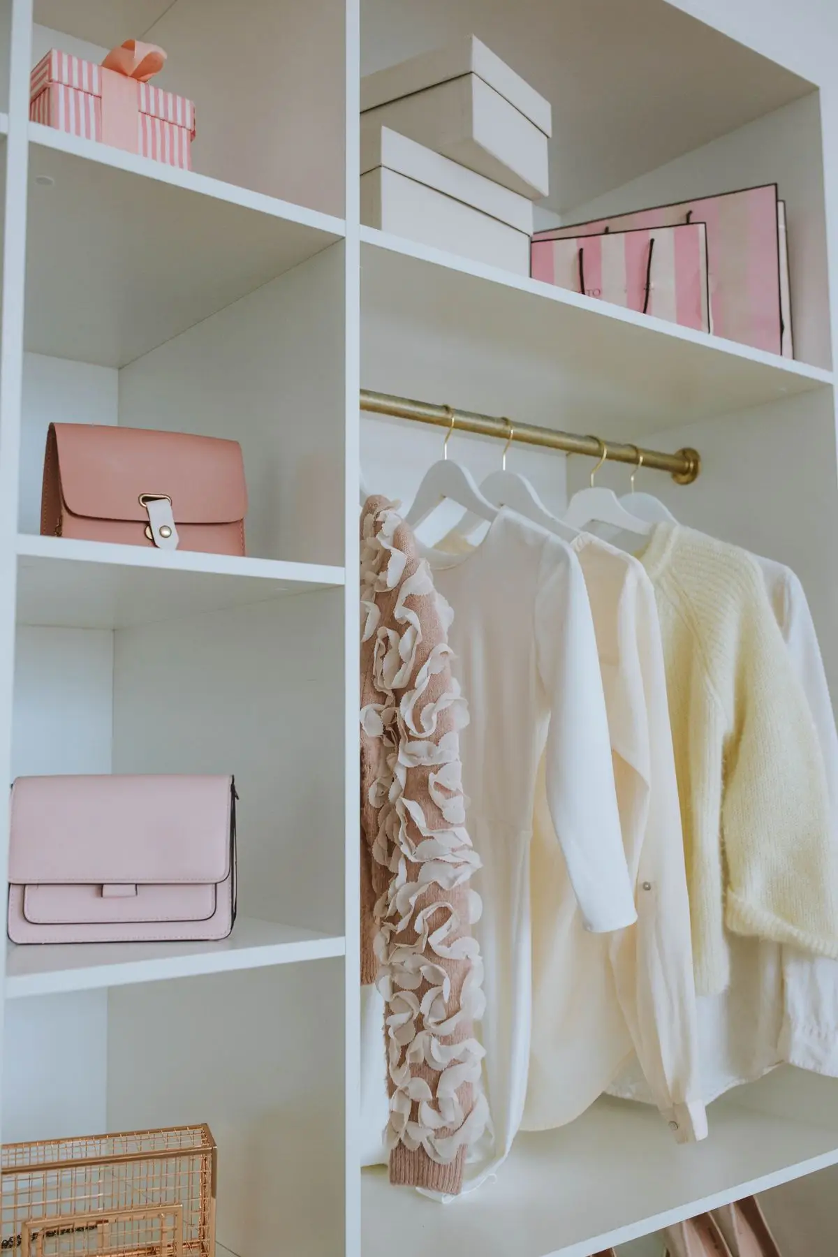 Custom closet with adjustable shelving and a hanging rod for organized storage